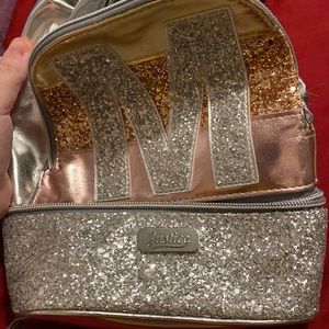 Small girls backpack sparkly with pink and an M on it
